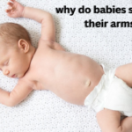 Why do babies sleep with their arms up